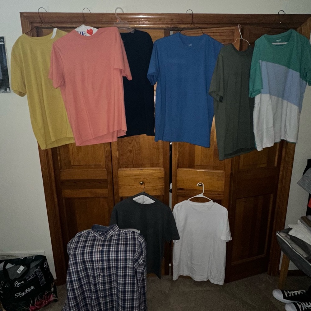 8 different colored T-shirts and 1 Button down Shirt